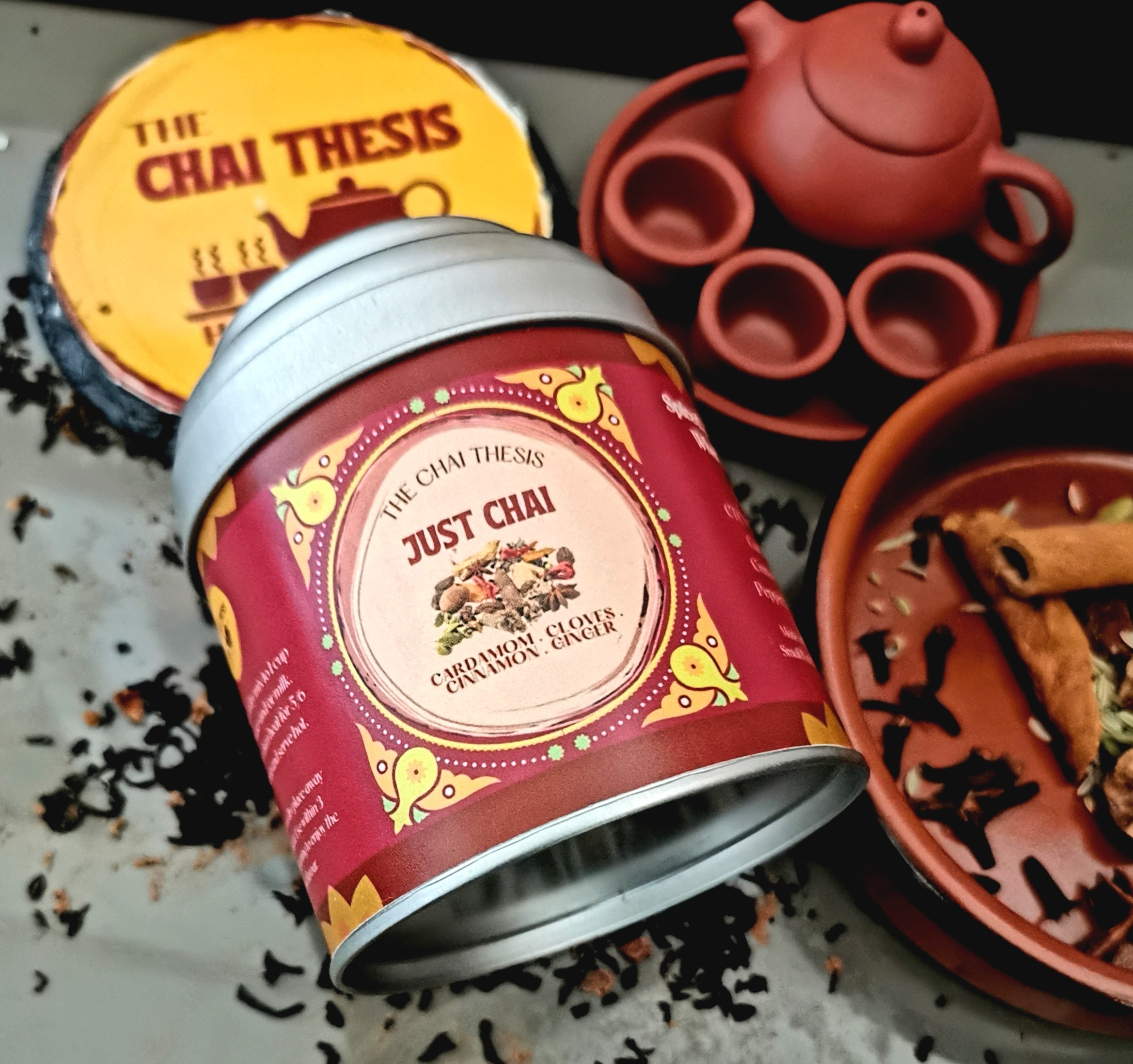 Just Chai tin with spices and teacup – authentic handcrafted masala chai blend